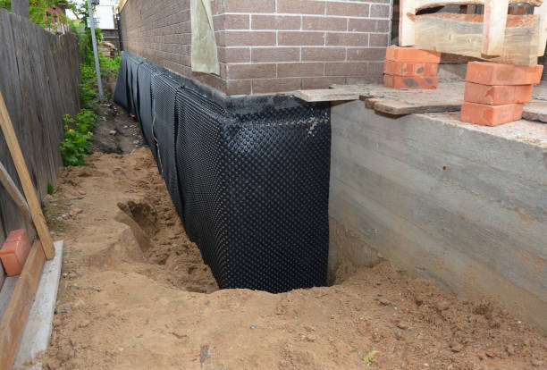 Happy homeowners after waterproofing job in Royersford